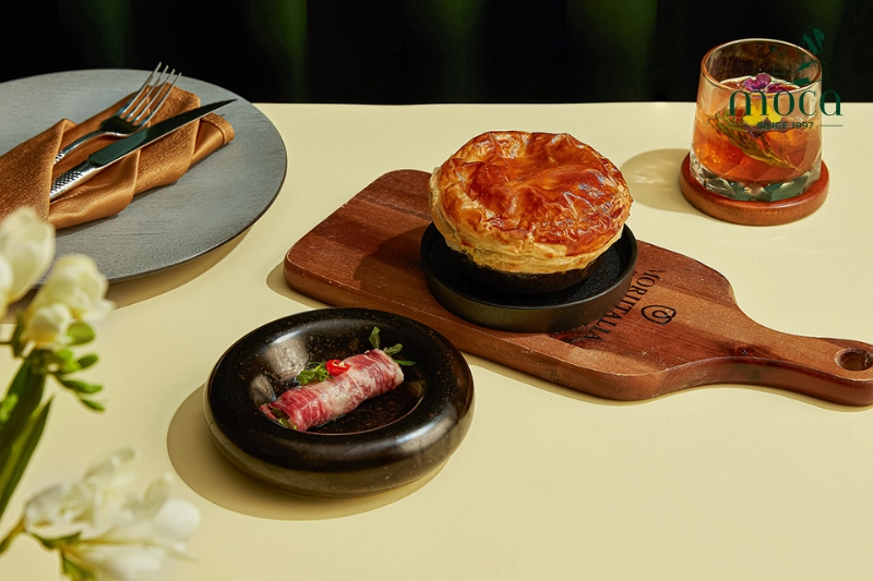 Moca Dining’s signature dishes evoke nostalgic traditional flavors, elevated with sustainable local ingredients and a sophisticated beverage program, creating a harmonious blend of taste and experience.