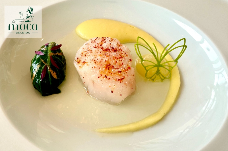 Basque seafood with grilled octopus and heirloom vegetables, highlighting asador tradition.