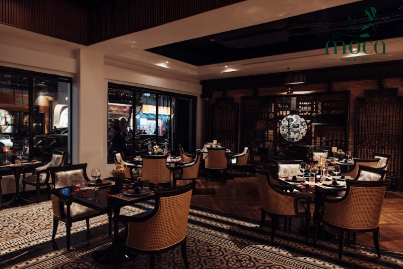 Indochine architecture: A refined blend of dark wood, patterned tiles, and natural light, creating spaces that are elegant yet in harmony with nature.