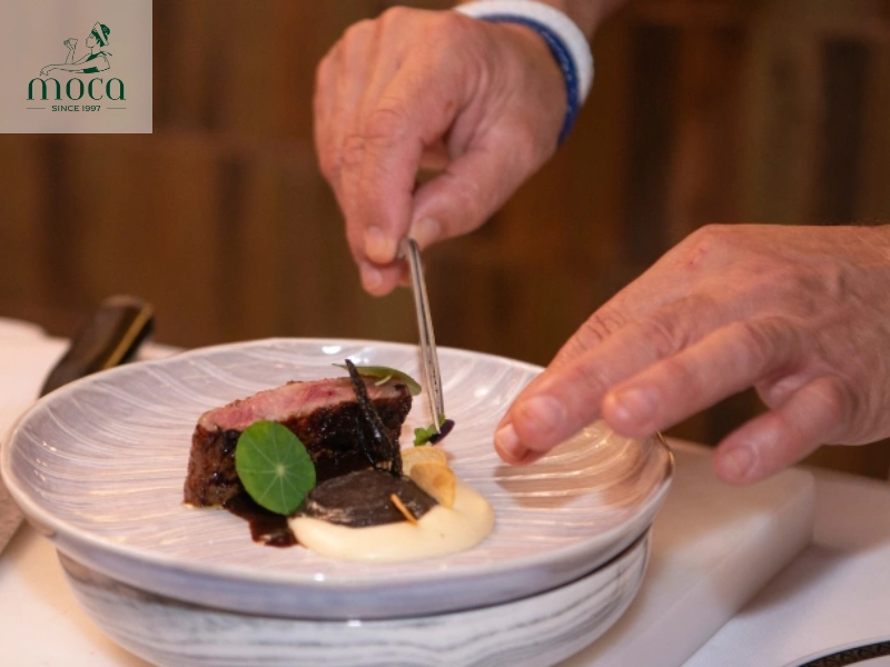 The Michelin Star focuses solely on the culinary experience, with the quality and artistry of the food being the primary factor.