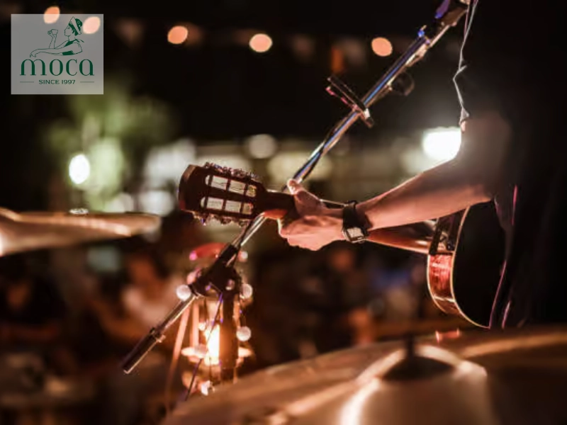 Diners savor a sophisticated meal with live music, creating a relaxed, social, and memorable dining experience.